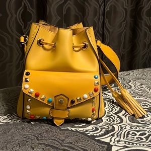 Beautiful yellow studded handbag